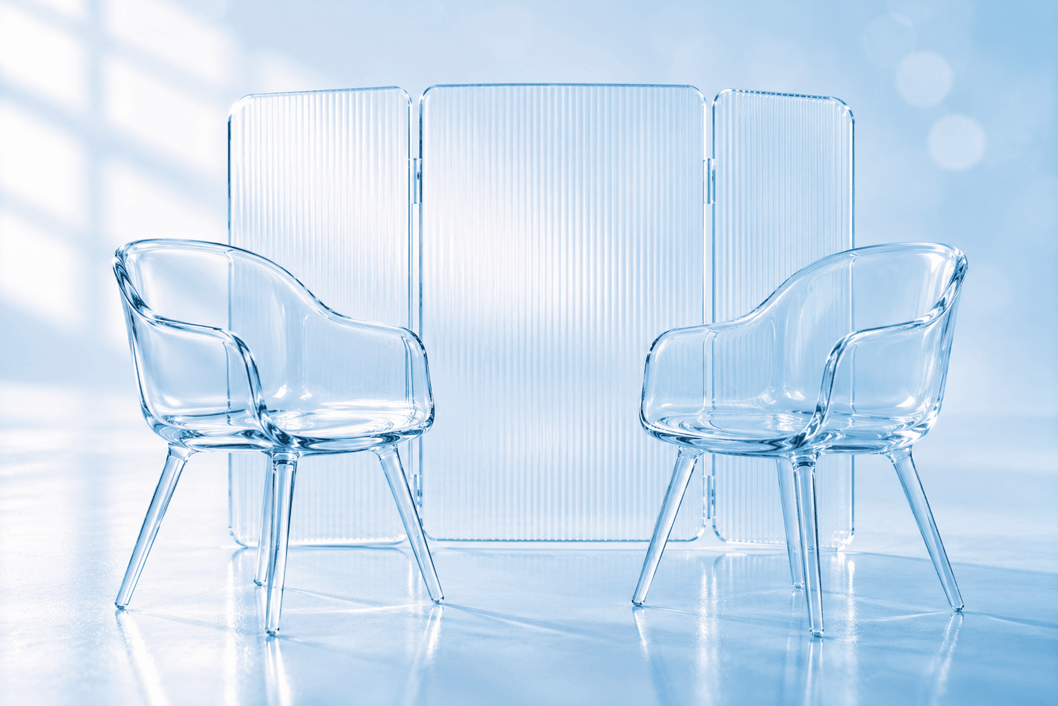Two empty glass chairs facing each other behind a privacy screen, illustrating a first counselling session and what stays confidential